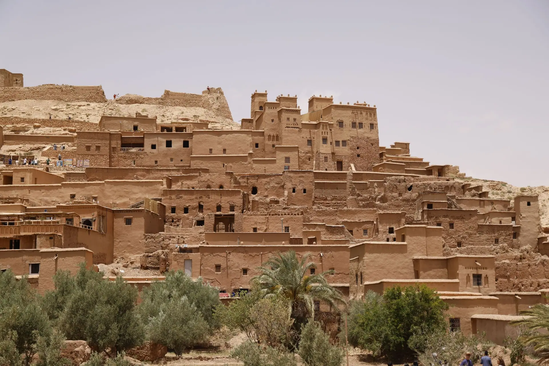 Explore the ancient architecture of Ait Benhaddou village in Morocco's arid landscape.