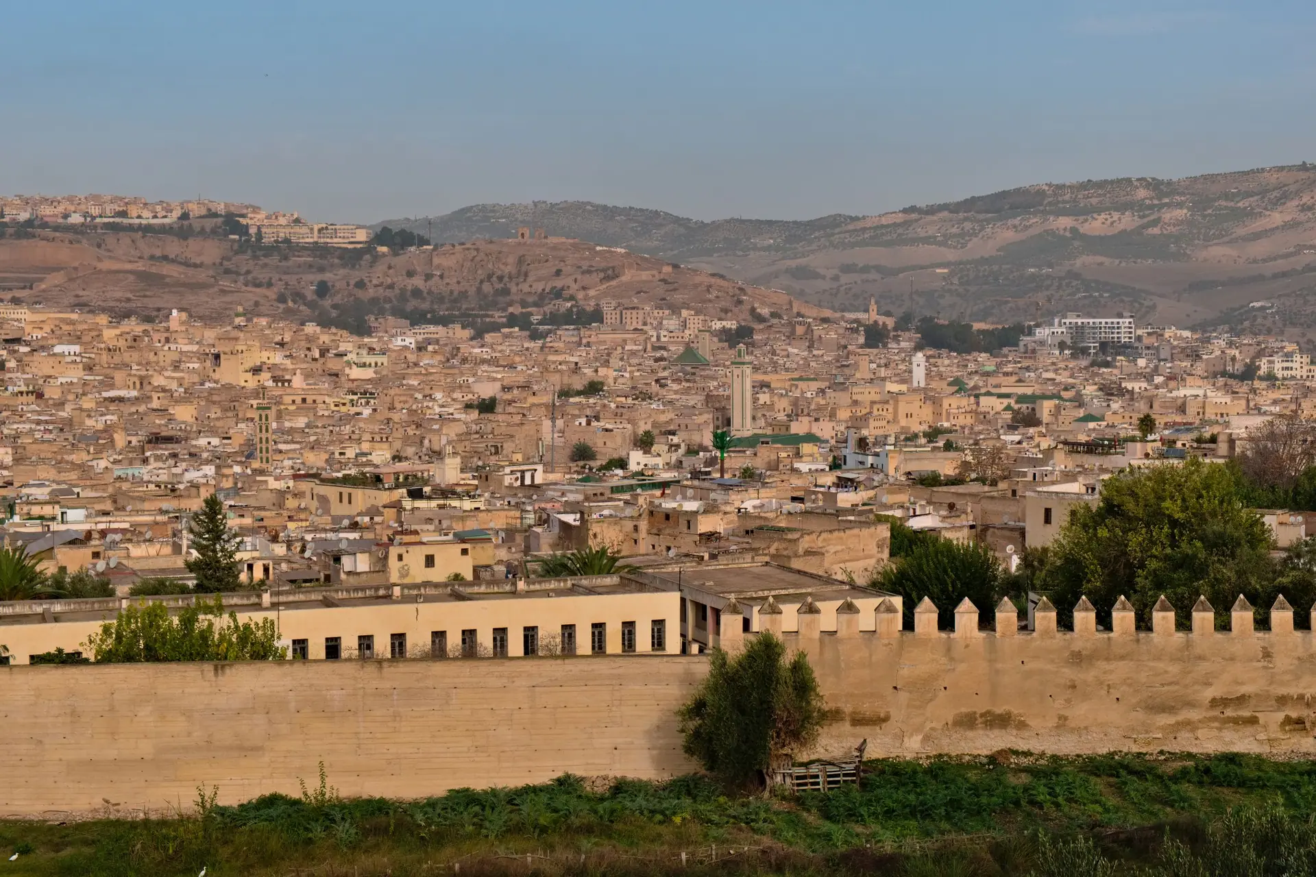 Explore the historic cityscape of Fes, Morocco, showcasing its unique architecture and sprawling urban landscape.